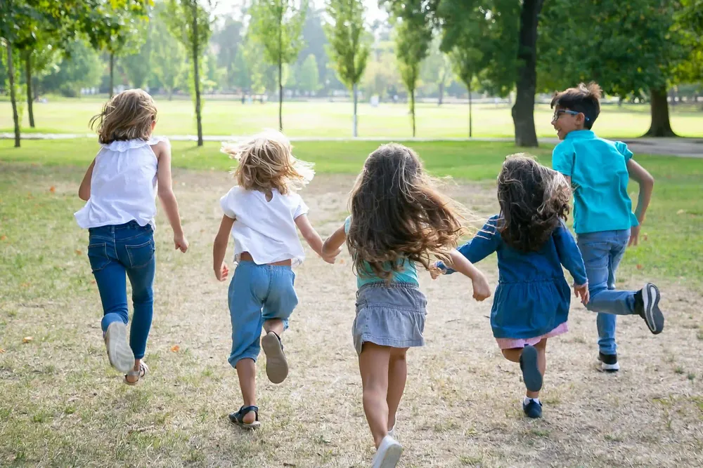 group-kids-running-grass-together-having-race-park-back-view-full-length-children-outdoor-activity-concept